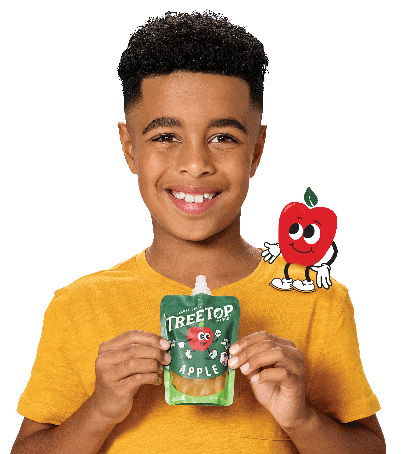 A young boy playfully interacts with a pouch of apple sauce.